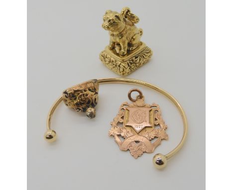 A 9ct gold bangle, 9ct medallion and gold mounted fob seal weight combined 16.2gms, together with a gold plated metal large f