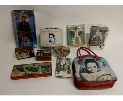 A lot comprising an Elvis Presley alarm clock, Elvis Presley Cartex novelty radio, Elvis Presley handbag, Elvis Presley 1968 