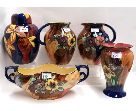 A collection of H &amp; K Tunstall pottery including Iris decorated vase, flower decorated ginger jar, two Viola jugs and a p