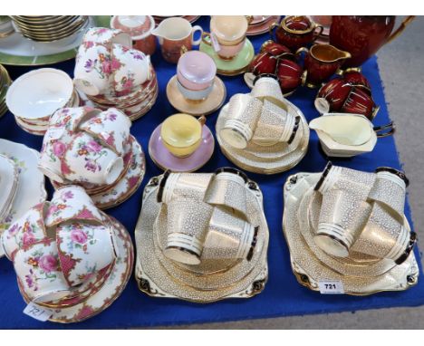 A Plant Tuscan Art Deco teaset comprising eleven cups, nine saucers, twelve plates, two cake plates and a milk jug, together 