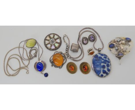 Silver mounted amber items, a ceramic shard pendant, chain and other items Condition Report: Not available for this lot
