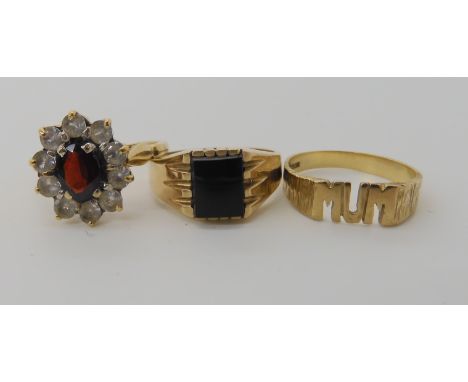 A 9ct gold garnet and clear gem set cluster ring size N1/2, a 9ct onyx signet ring N1/2 and a 9ct MUM ring size M, combined w