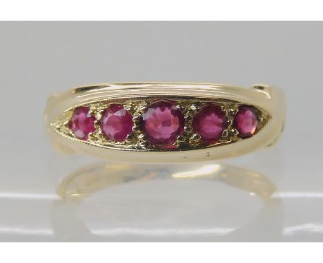 A 9ct gold ruby five stone ring, hallmarked Sheffield 1919, finger size M1/2, weight 3gms Condition Report: Available upon re