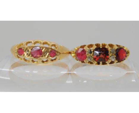 An 18ct gold red gem and diamond chip ring size O, together with a similar example size Q1/2, weight combined 5.3gms Conditio