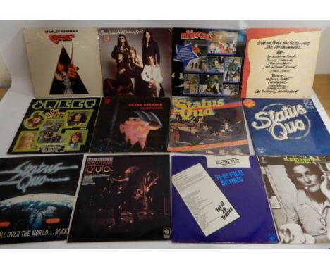 A box of rock and heavy metal vinyl LP records with Black Sabbath, Sweet, Status Quo, The Boom Town Rats, The Who, The Jam, S