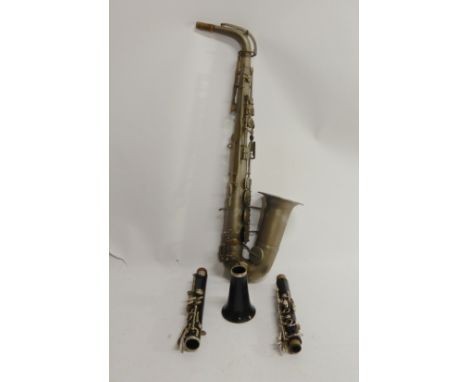 A Universal Havana Paris 470 alto saxophone and a part clarinet together with an instrument case Condition Report: Available 