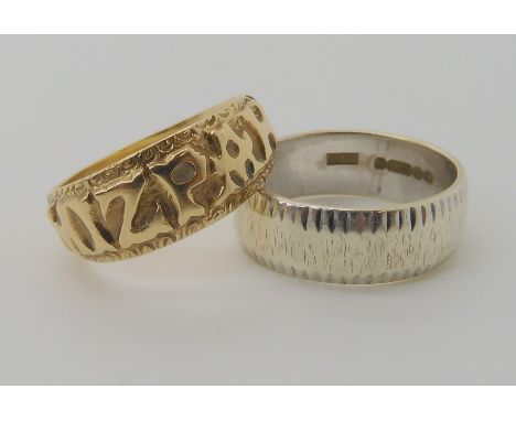 A 9ct gold MIZPAH ring, size L together with a 9ct white gold wedding ring size K, weight together 6.3gms Condition Report: A