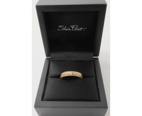 A 9ct gold knot work ring by Sheila fleet in original box, finger size P1/2, weight 4.3gms Condition Report: Available upon r