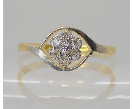 An 18ct gold diamond flower ring, set with estimated approx 0.20cts of old cut diamonds, size Q, weight 2.2gms Condition Repo