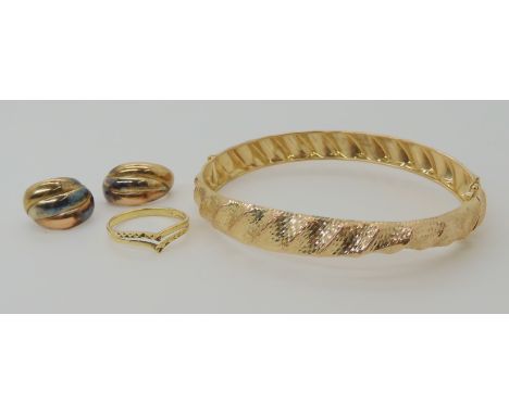 A 9ct gold bangle (af), a 9ct ring size Q, and a pair of three colour gold earrings, weight combined 9gms Condition Report: A