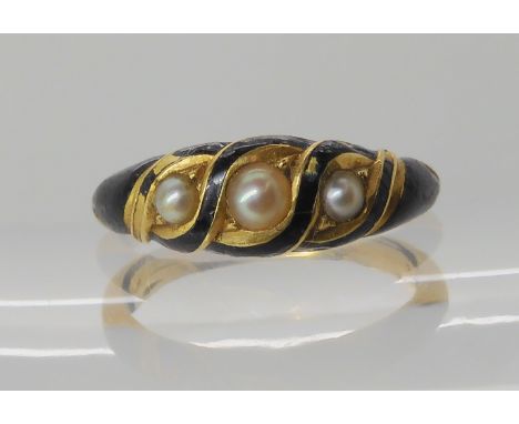 A bright yellow metal locket back mourning ring with black enamel and set with pearls, size approx J, weight 4.4gms Condition