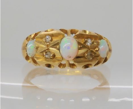 An 18ct gold opal and diamond chip ring, hallmarked Chester 1918, size N, weight 4.3gms Condition Report: Available upon requ