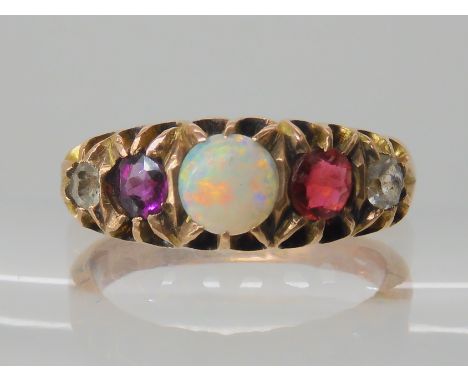 A 9ct gold red, clear and opal set cluster ring, size T1/2, weight 7gms Condition Report: Has been re shanked bears a 1981 ha