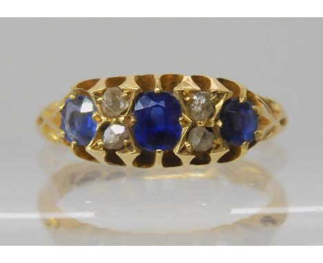 An 18ct gold sapphire and rose cut diamond ring , size J, weight 2.8gms Condition Report: Available upon request