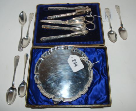 A lot comprising a cased set of grape scissors/nut crackers, a silver card tray, London 1932 and six assorted silver teaspoon