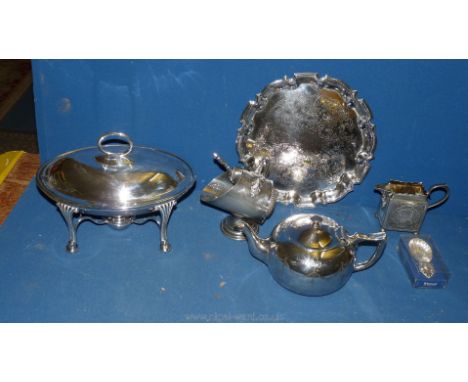 A quantity of plated items including salver, milk jug, caddy spoon and Epns Teapot, crumpet dish and sugar holder with shovel