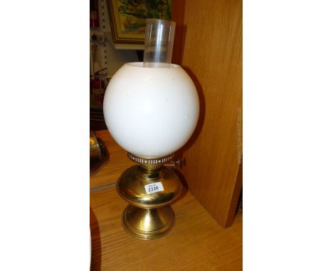 A Brass Lamp with glass shade