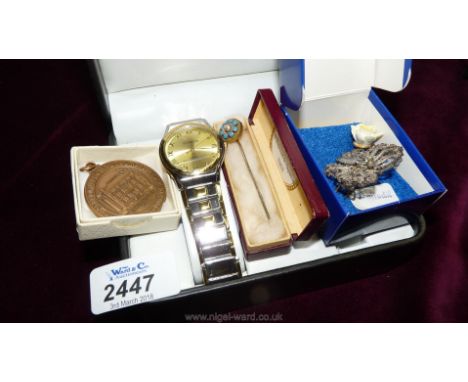 A Geneva quartz wristwatch, stick pins, etc