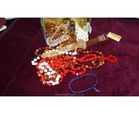 Miscellaneous costume jewellery including beads, crucifix, swatch skeleton watch, etc