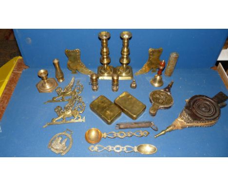 A quantity of brass including three candlesticks, two old tobacco tins, mantle boots, clock weight, two set bellows, etc. 
