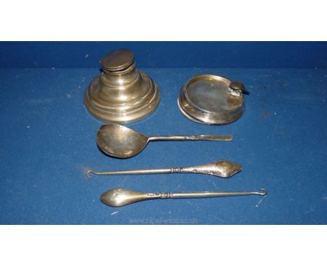 A Silver Inkwell, silver Ashtray (as found), two Silver and steel button hooks and an old handcrafted white metal Spoon