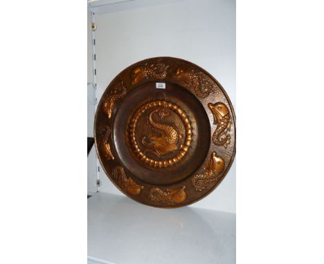 A large Poole of Hayle Copper Charger showing central dolphin and eight dolphins to rim , 59 cms diameter
