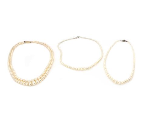 Two graduated cultured pearl necklaces,comprising a single row of graduated cultured pearls, strung knotted to silver safety 