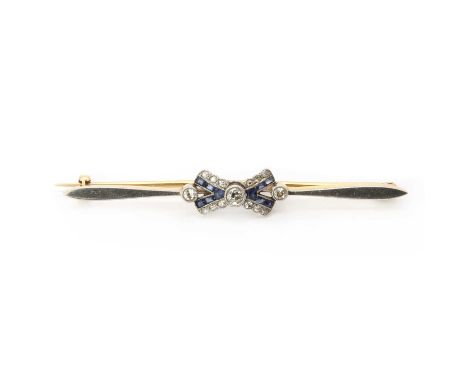 An early 20th century gold sapphire and diamond brooch,three old brilliant cut diamonds, bezel and millegrain set, to a split