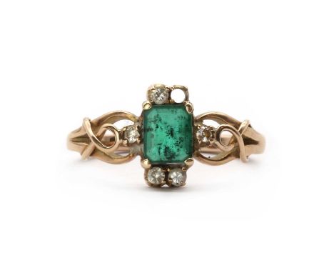 A gold emerald and diamond ring, an emerald cut emerald to surround of brilliant cut diamonds, one deficient, to openwork sho