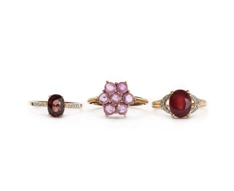 Three 9ct gold rings,comprising a fracture filled ruby and diamond ring, the fracture filled ruby approximately 10 x 8mm, Bir