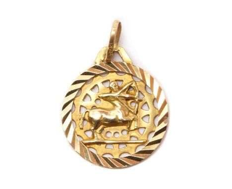 A gold zodiac pendant,a Sagittarius zodiac sign to a triangular pierced backing and patterned surround, tested as approximate