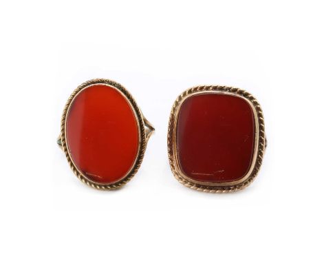 Two 9ct gold cornelian rings,comprising a 9ct gold cornelian ring, an oval cornelian tablet, bezel set, to a mount with a twi