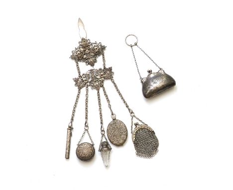 A sterling silver purse, of shaped outline with hand engraved decoration and monogram, to chain and finger ring, and concerti