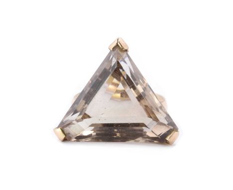 A 9ct gold single stone smoky quartz ring, a triangular step cut smoky quartz, approximately 18mm, claw set to tapered should