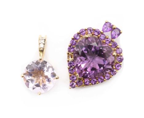 Two gold amethyst pendants,comprising a 9ct gold amethyst pendant, with a heart mixed cut amethyst in a claw setting, approxi