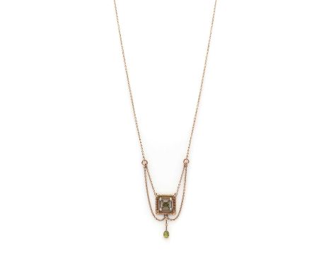 An Edwardian gold peridot and split pearl pendant,a peridot and split pearl pendant, suspending an articulated peridot drop, 
