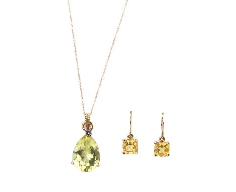 A 9ct gold citrine and diamond pendant, with a pear mixed cut citrine, approximately 18 x 13mm, three claw set, top claw grai