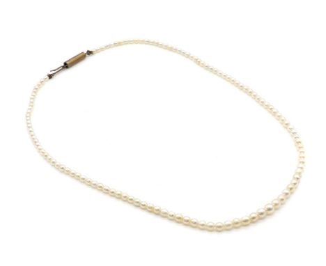 A single row graduated pearl necklace, a row of graduated pearls, 2.20 to4.30mm, untested, to a base metal barrel clasp, 375m