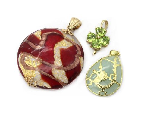 Three gold pendants,comprising a 9ct gold peridot pendant in the form of a four leaf clover, Birmingham, a Murano glass bead 