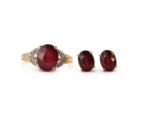 A 9ct gold fracture filled ruby and diamond ring, with an oval mixed cut fracture filled ruby claw set, approximately 10 x 8m
