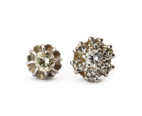 Two gold single diamond stud earrings,comprising a single white gold diamond earring, a central brilliant cut diamond, claw s