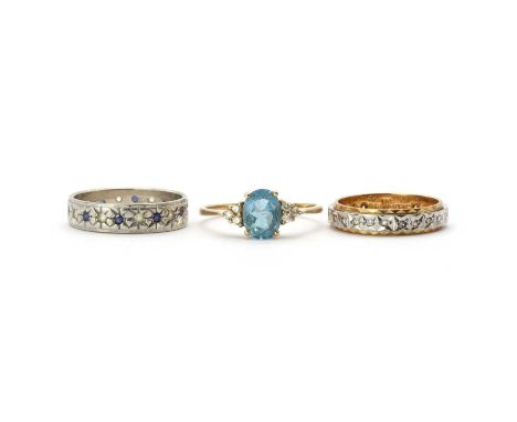 Three 9ct gold rings, comprising a 9ct gold topaz and diamond ring, London import mark 1989, a 9ct gold diamond full eternity
