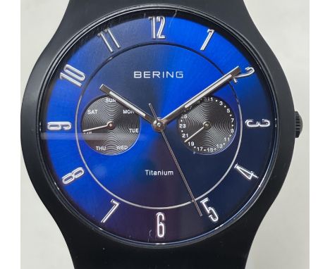 A gentleman's titanium Bering 11939-078, on a stainless steel mesh strap, boxed, with guarantee and instruction manual, and t