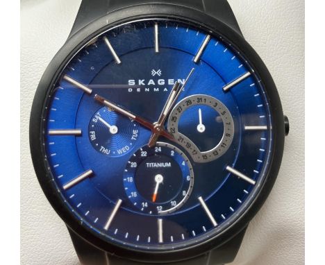 A gentleman's titanium Skagen 809XLTBLN wristwatch, on a leather strap, boxed, with warranty and instruction booklet, and ano