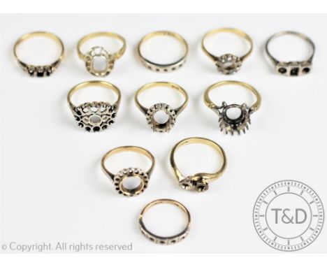 Eleven vacant ring mounts, in white and yellow metal, hallmarked as 18ct gold or stamped '18ct', 35.8gms (11)