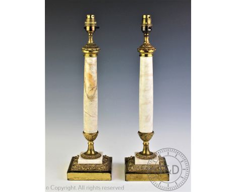 A pair of 19th century style marble and brass mounted lamp bases, each with a polished marble stem terminating with brass mou