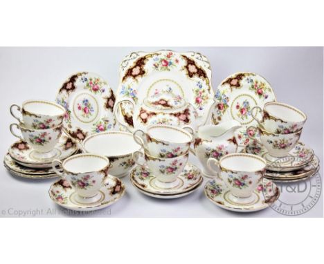 A Royal Tuscan Windsor pattern tea service comprising; a teapot, six teacups and saucers, six cake plates, a serving plate, a