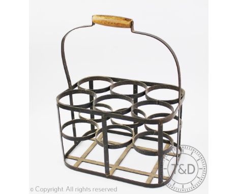 A vintage six division bottle carrier, with turned wooden handle, 41.5cm H x 33cm W x 22cm D