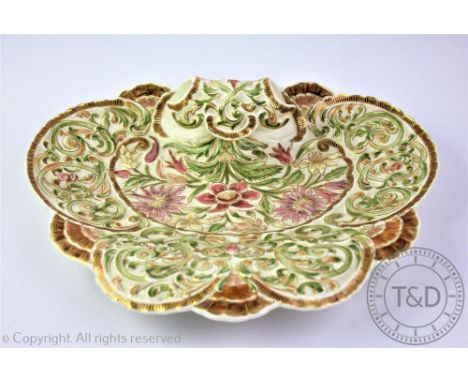 A Hungarian Zsolnay Pecs Schlittné anthemion moulded dish, extensively decorated in relief with Persian designs depicting for