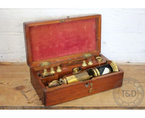 A late 19th century lacquered brass monocular microscope, in mahogany case, case 28cm wide, (at fault)